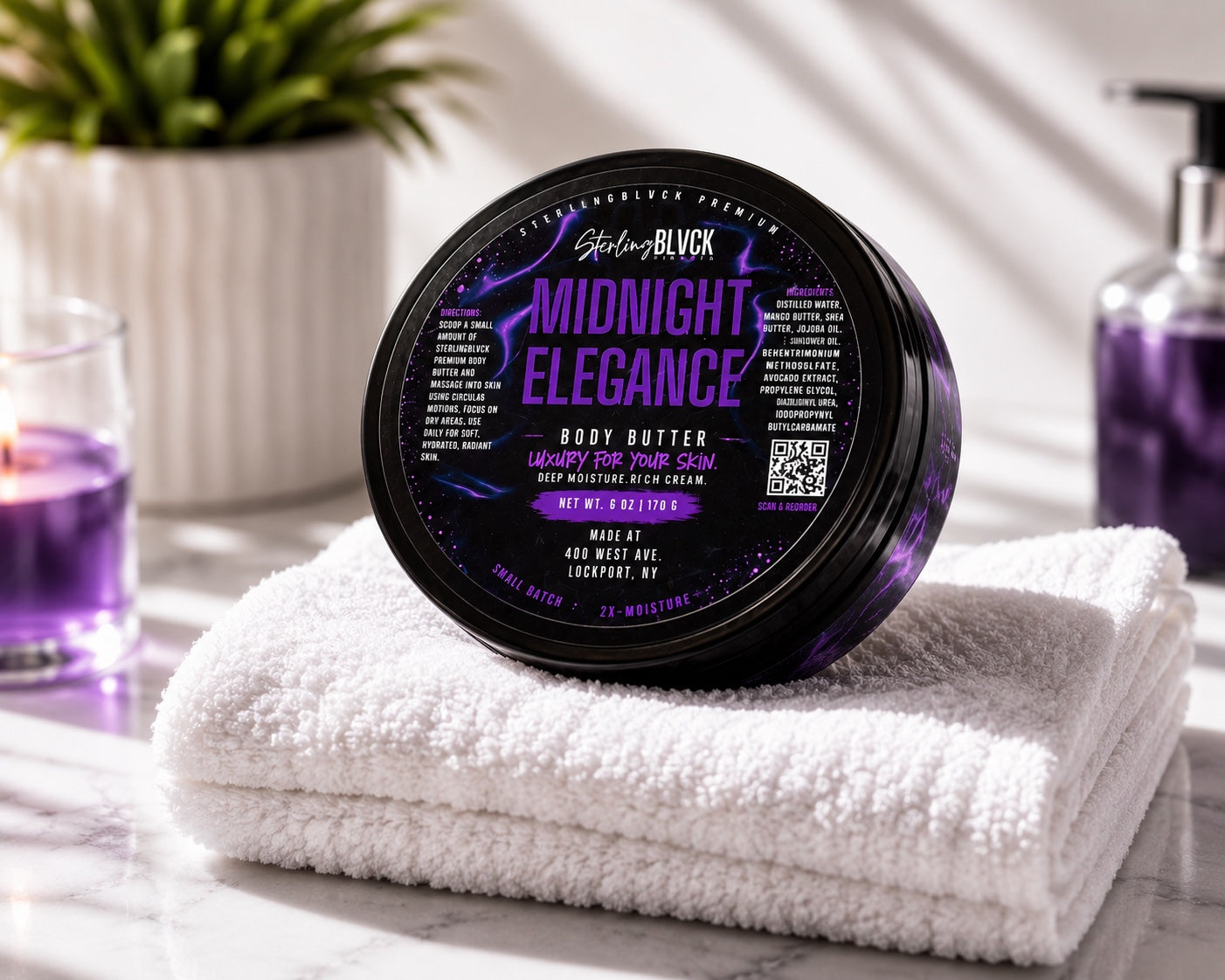 SterlingBLVCK Premium Midnight Elegance Body Butter displayed on white towels in a bright bathroom setting with purple accents.