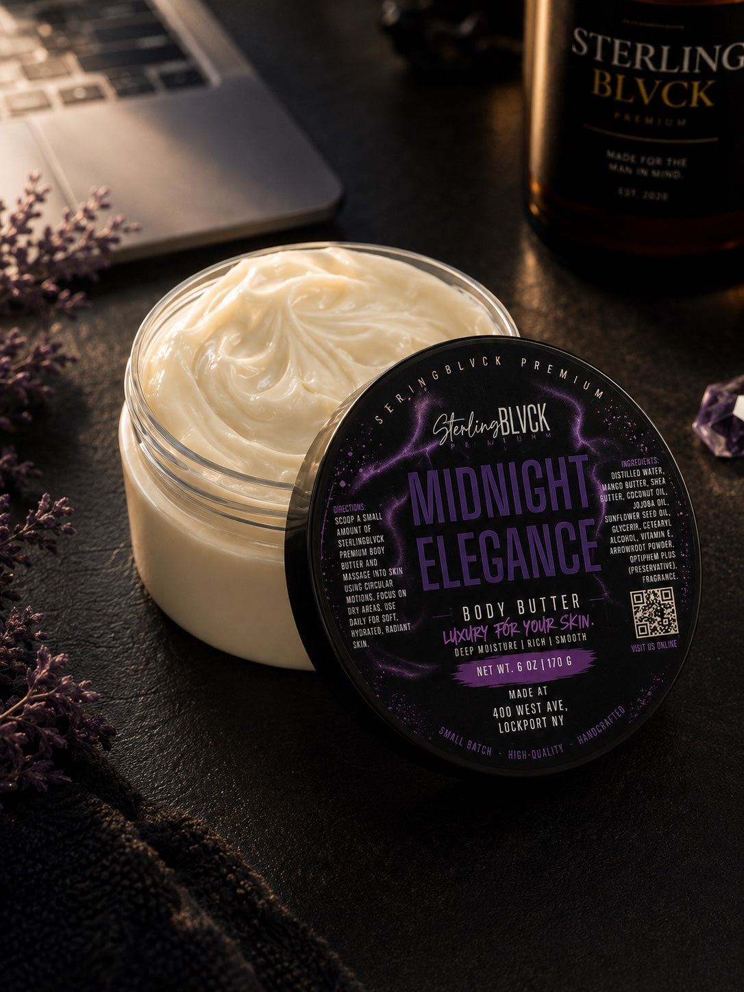 SterlingBLVCK Premium Midnight Elegance Body Butter with open jar and purple label in a dark luxury setting.